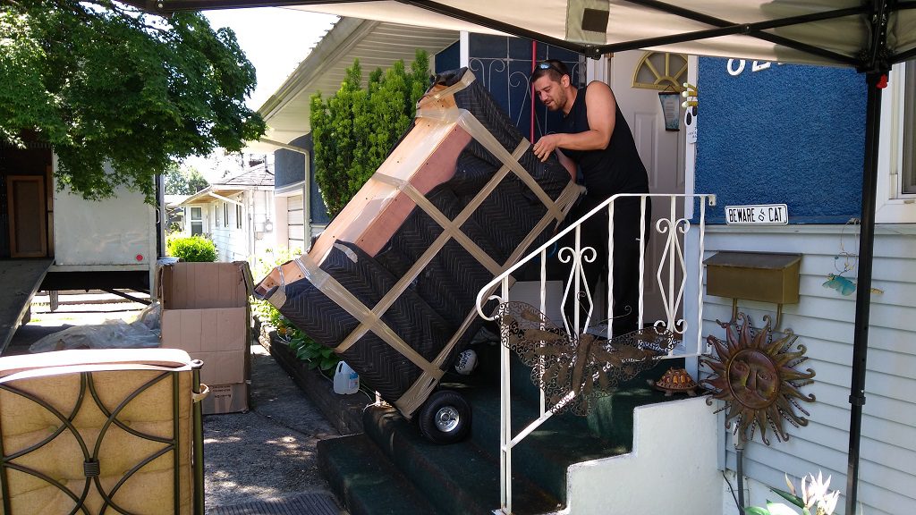 affordable Moving company burnaby Signature Moving loading a dresser